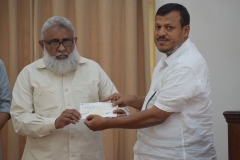 handing-over-the-amount-for-house-construction
